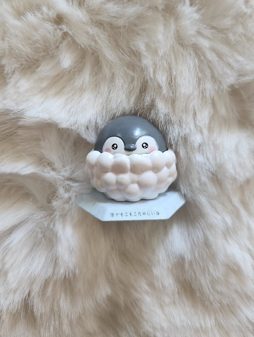 Cute baby penguin figure with bubbles